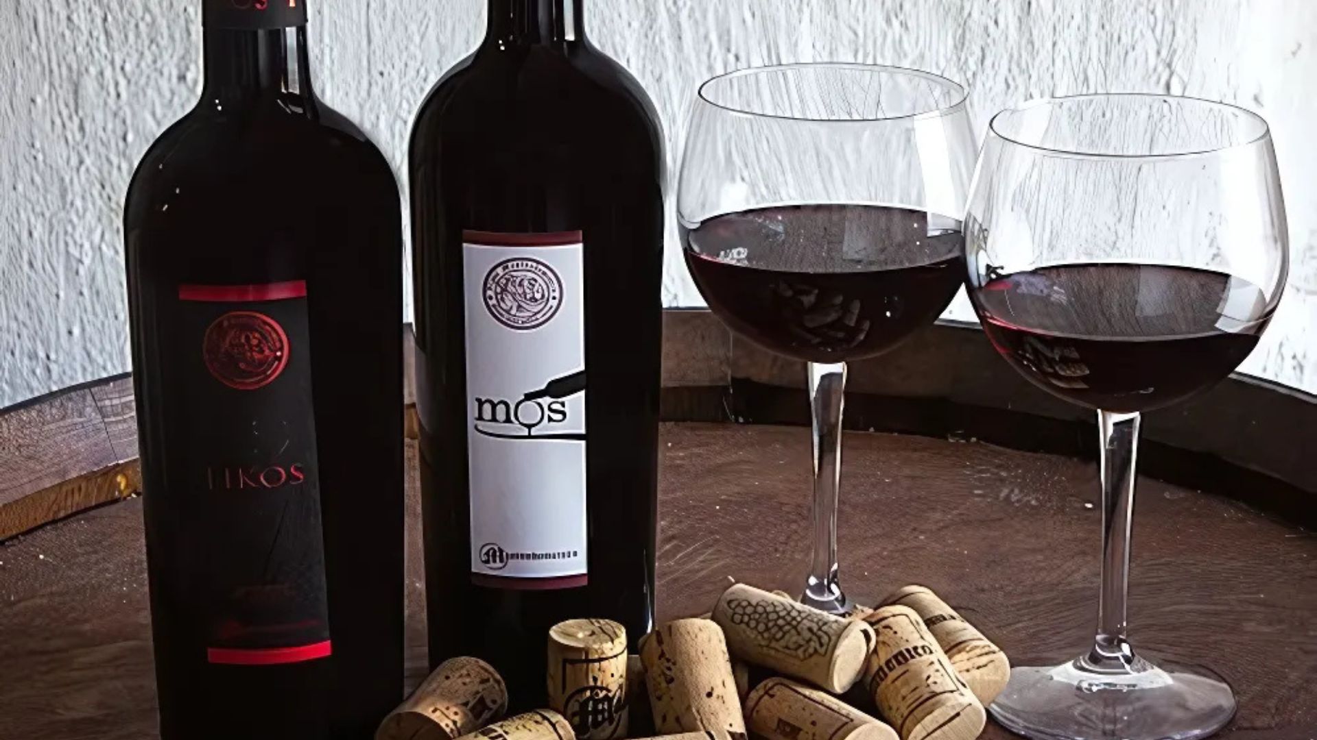 Image shows 2 bottles of Aglianico del Vulture and 2 wine glass.