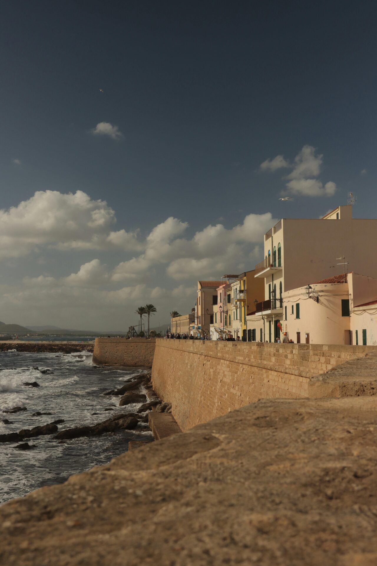 Historic sea wall along Alghero’s waterfront