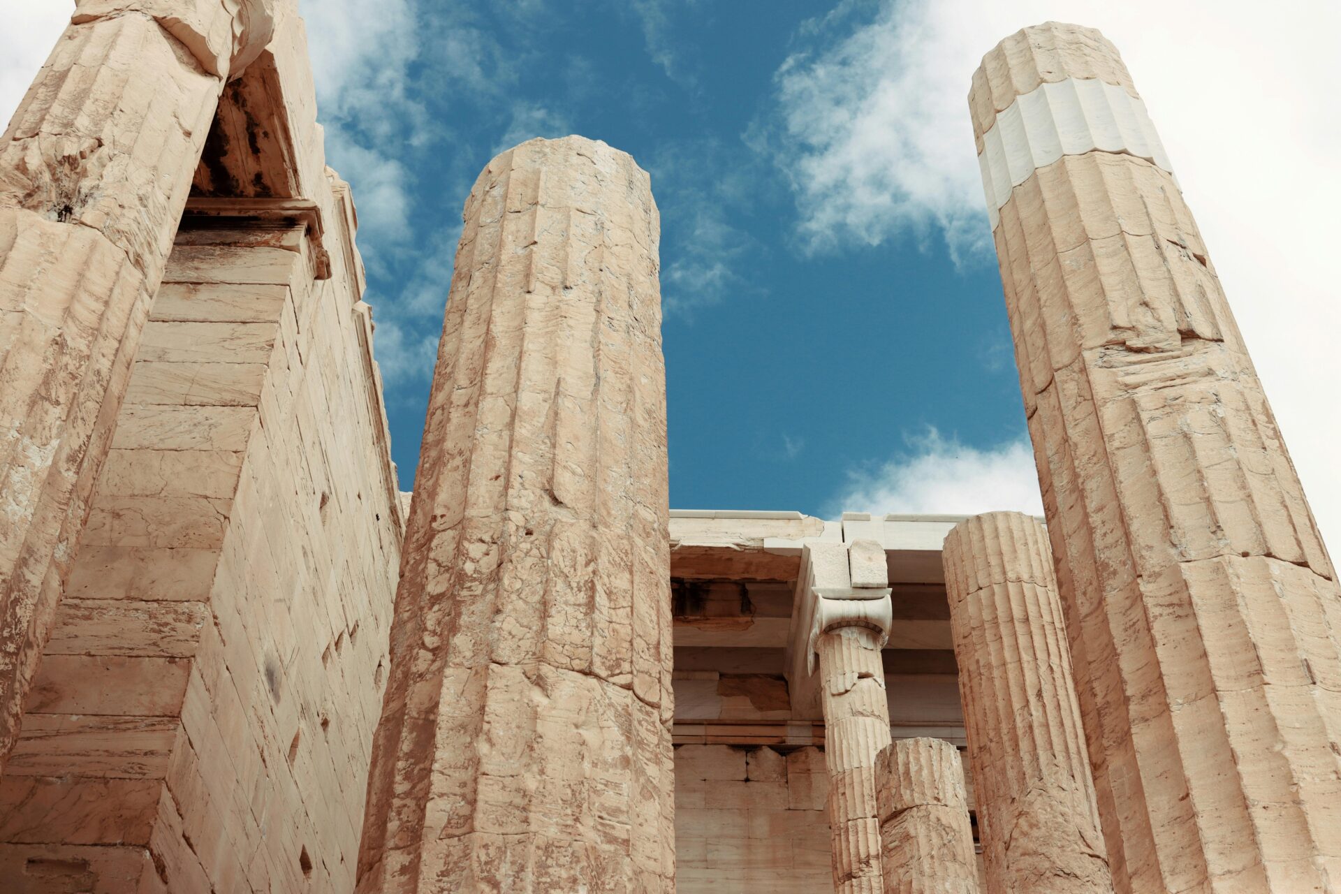 Ancient Greek Columns Under Blue Sky
