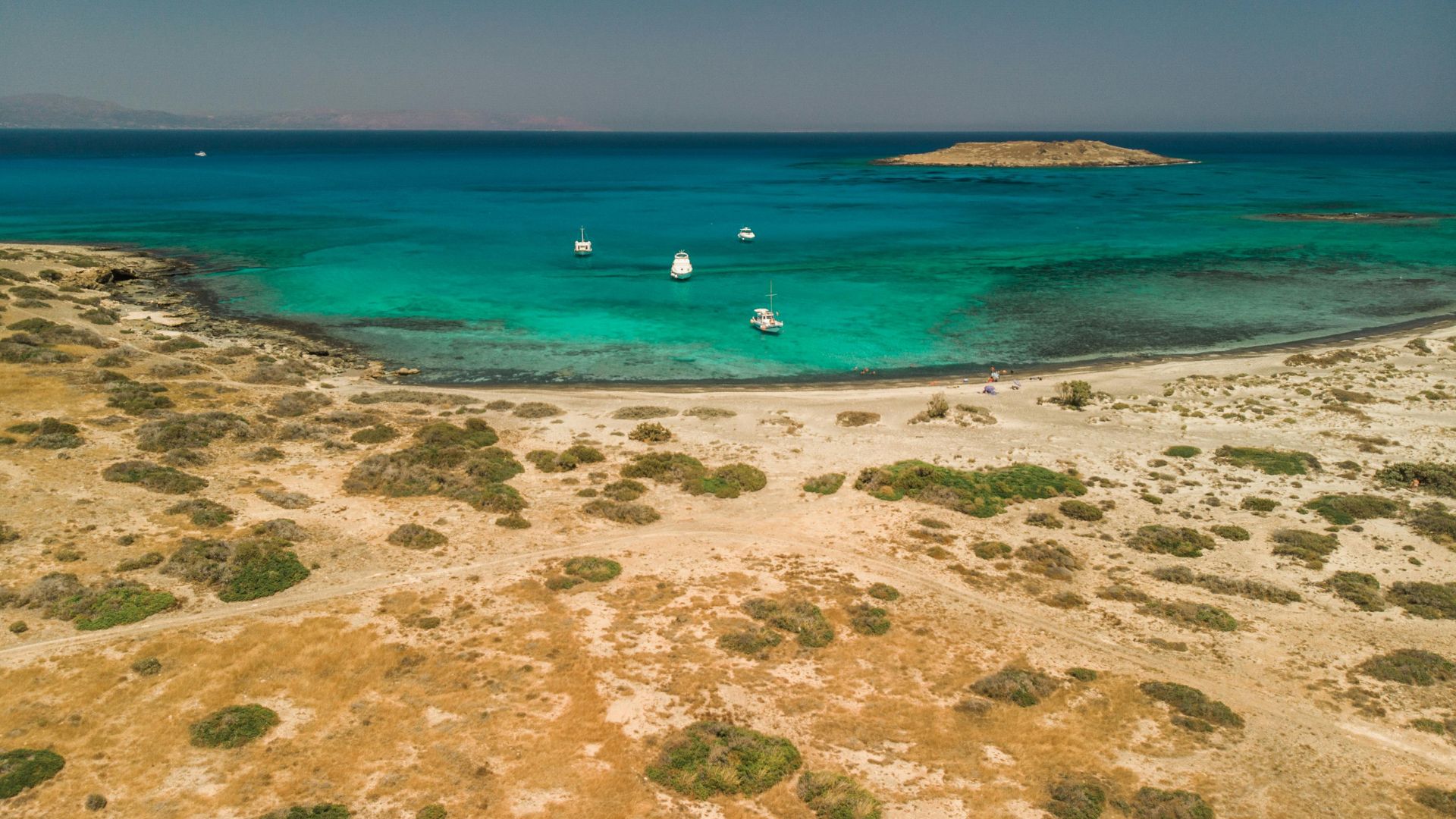 Aerial view of Balos Beach lagoon in Crete, with turquoise waters and sandy shores.