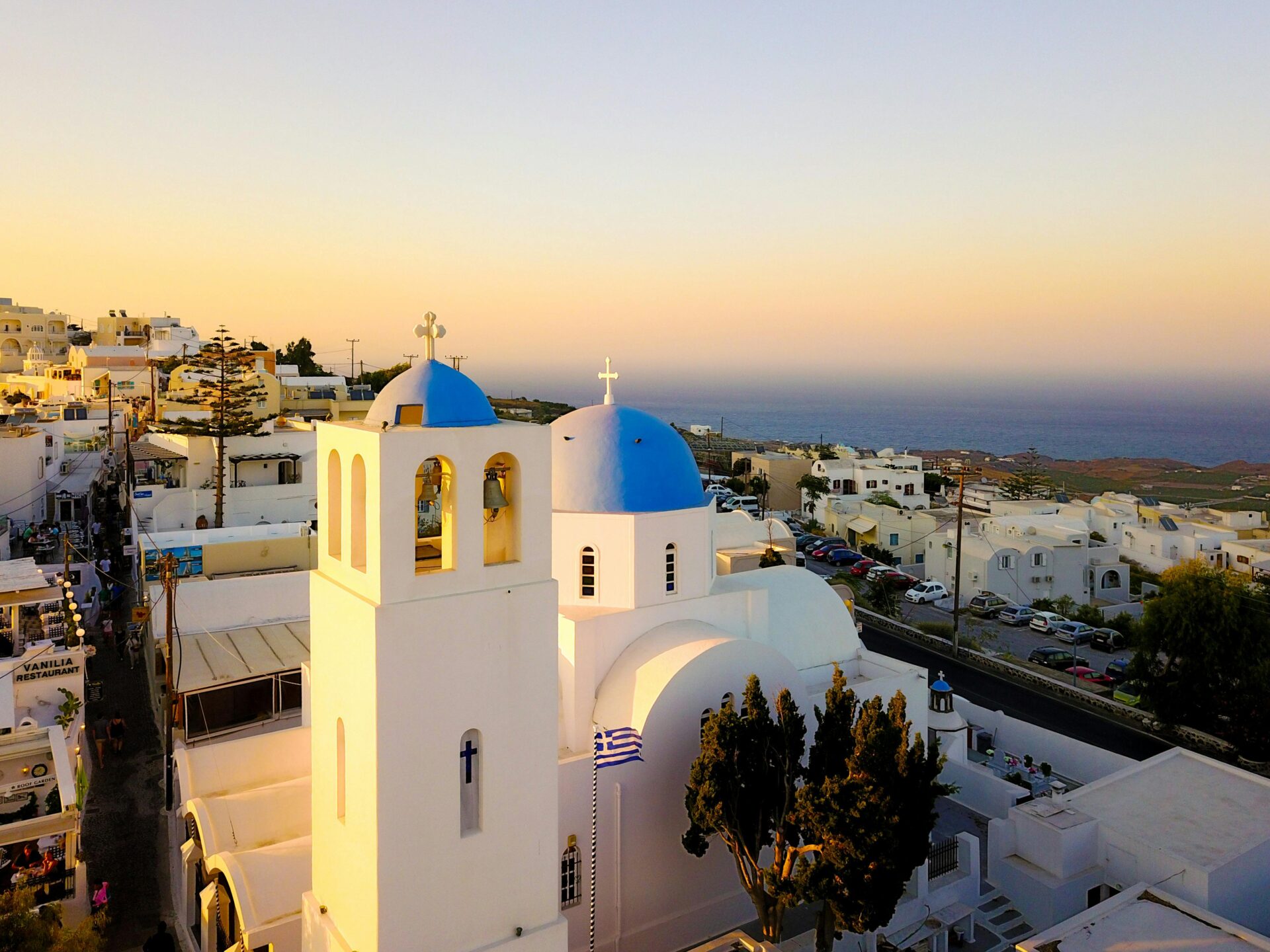A bell tower in Santorini - overlooking of a sea