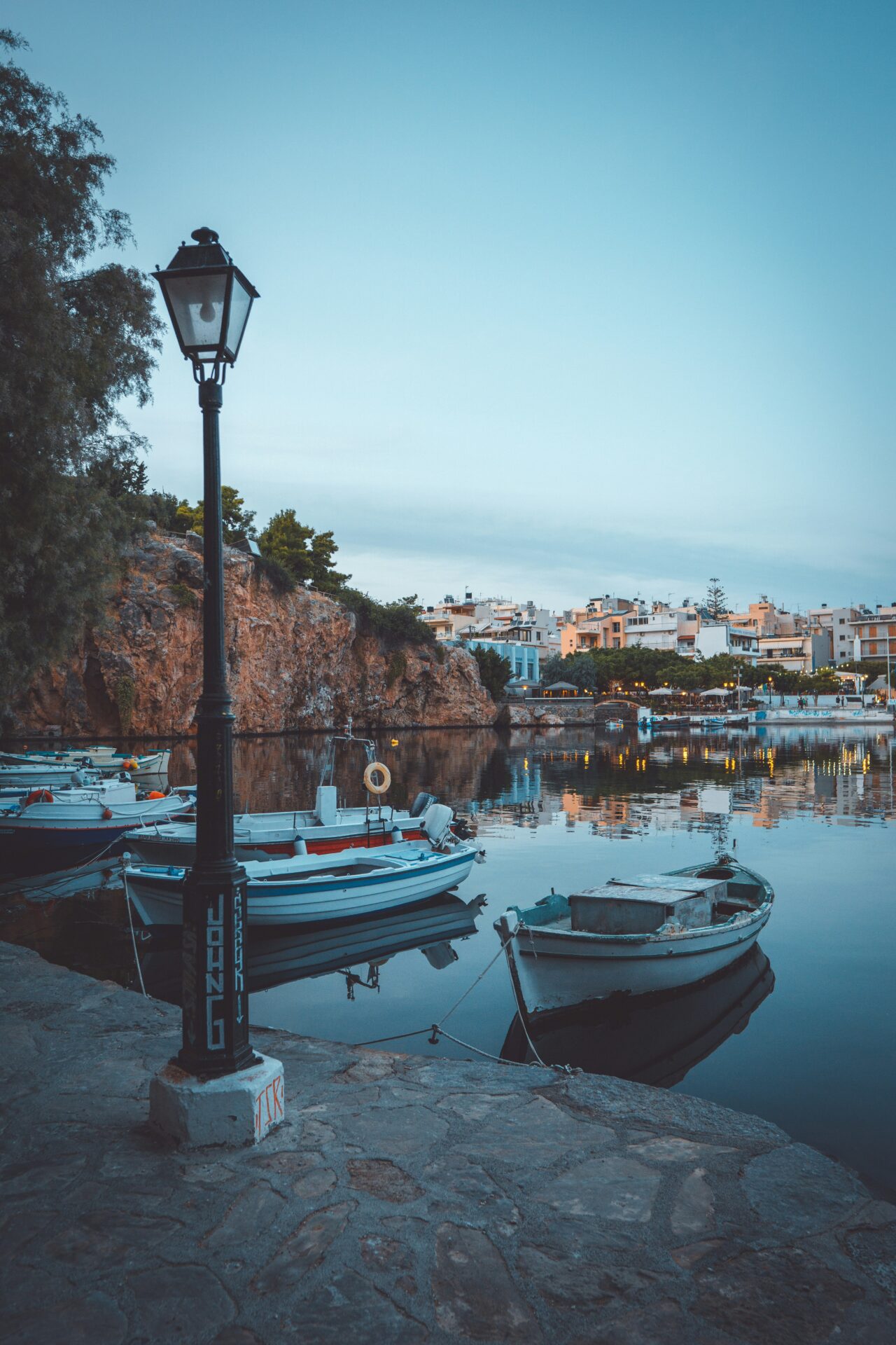 Colorful fishing boats docked at a harbor in Crete