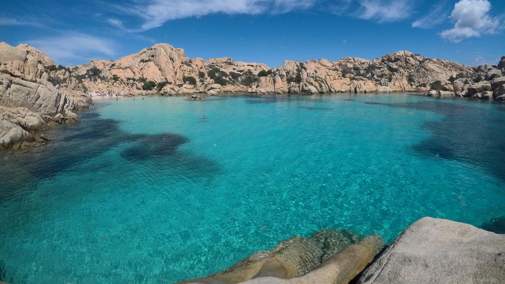 Turquoise color water, rocky cliffs and shores of Cala Coticcio beach in Caprera, Maddalena Archipelago, Sardinia, Italy.