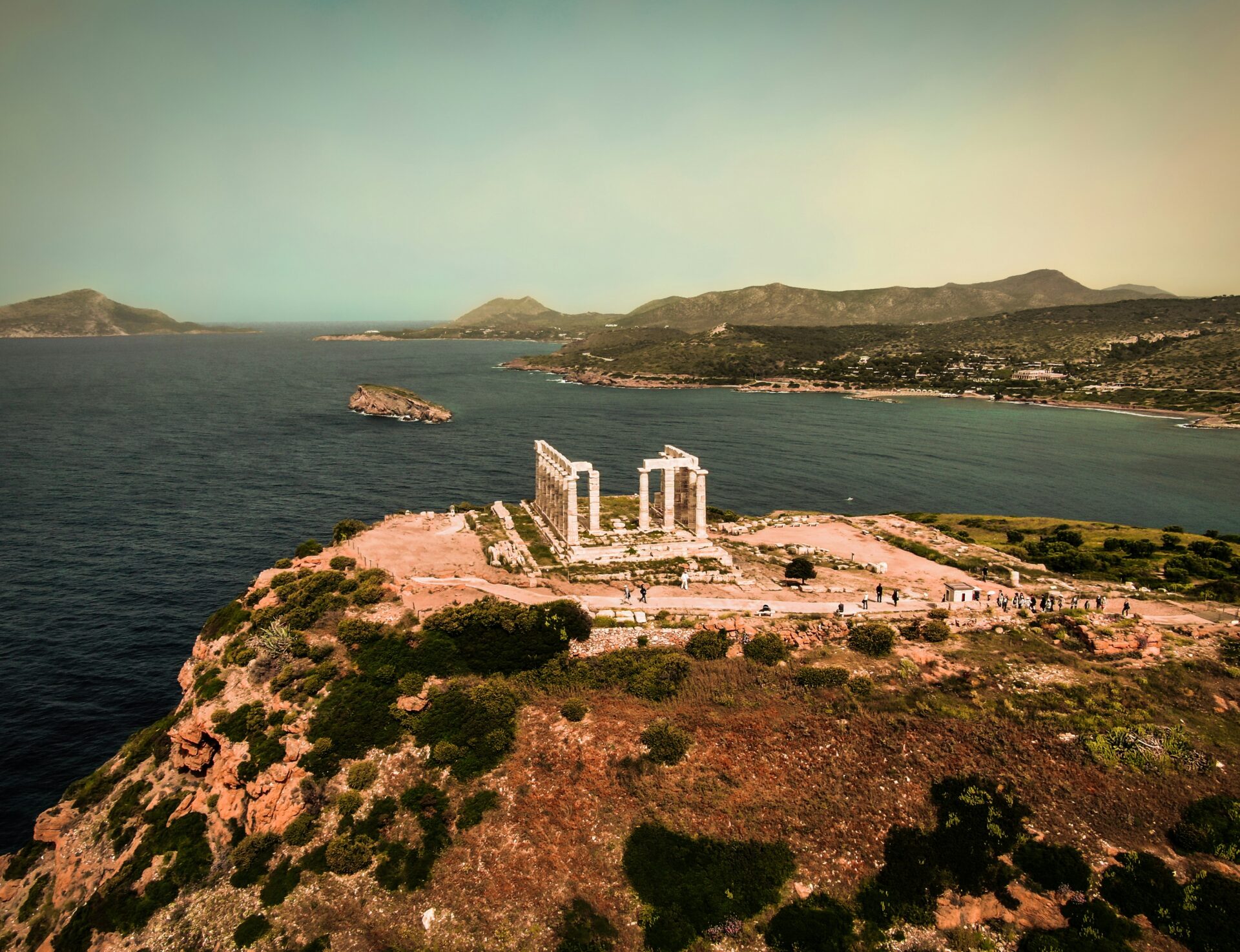 An aerial shot of the temple of Poseidon in Cape Sounion, Greece.