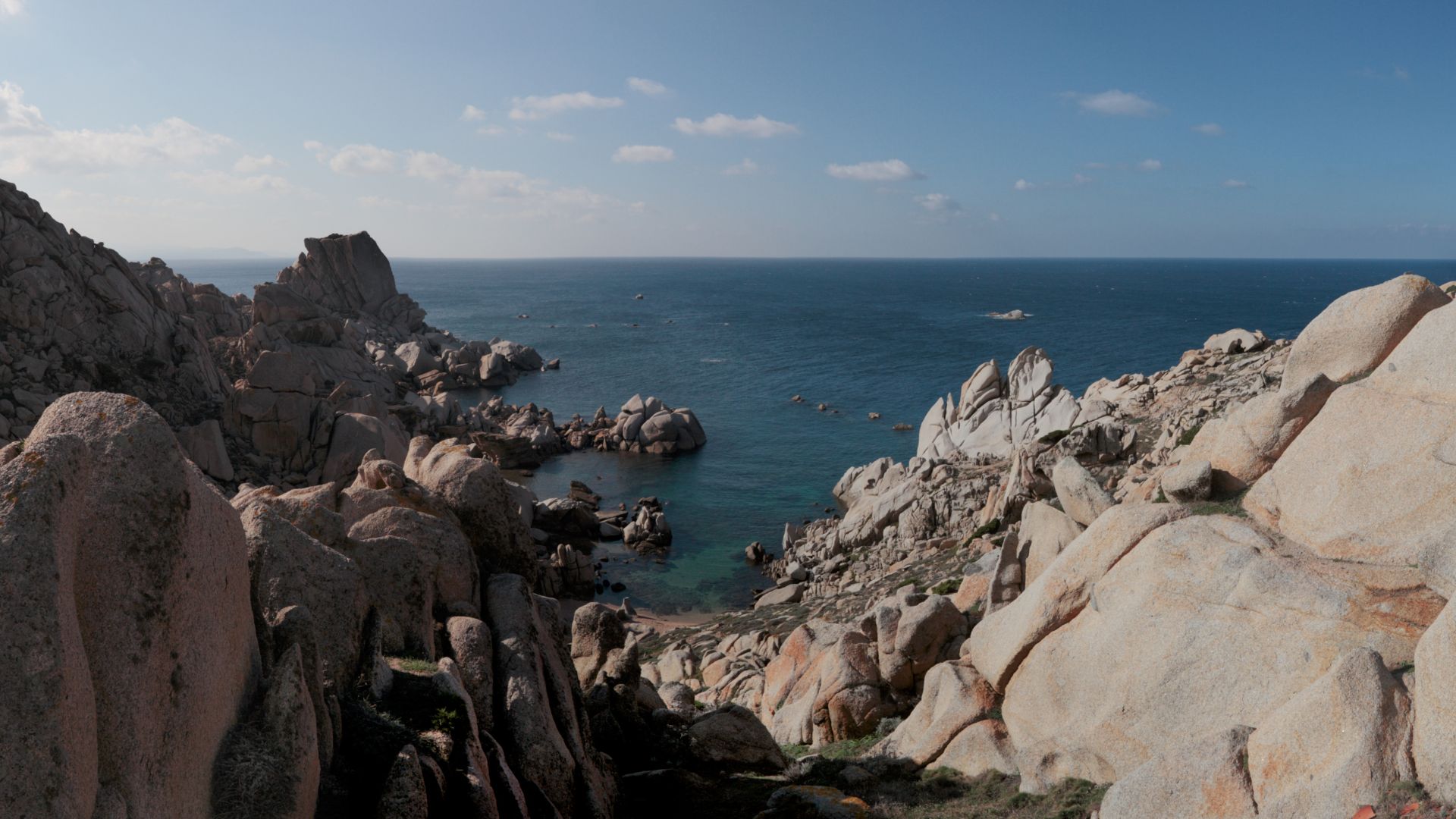 Granite rock formations at Capo Testa, Sardinia, with the sea in the background.