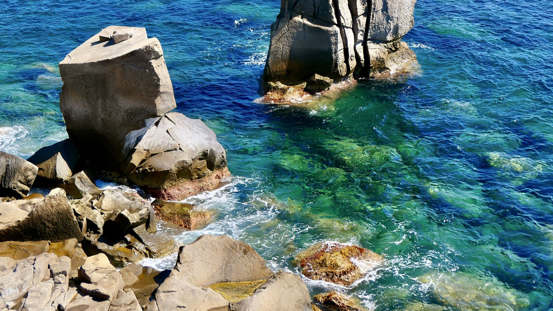 Crystal blue waters and rocky cliff of Carloforte, Sardinia, Italy.