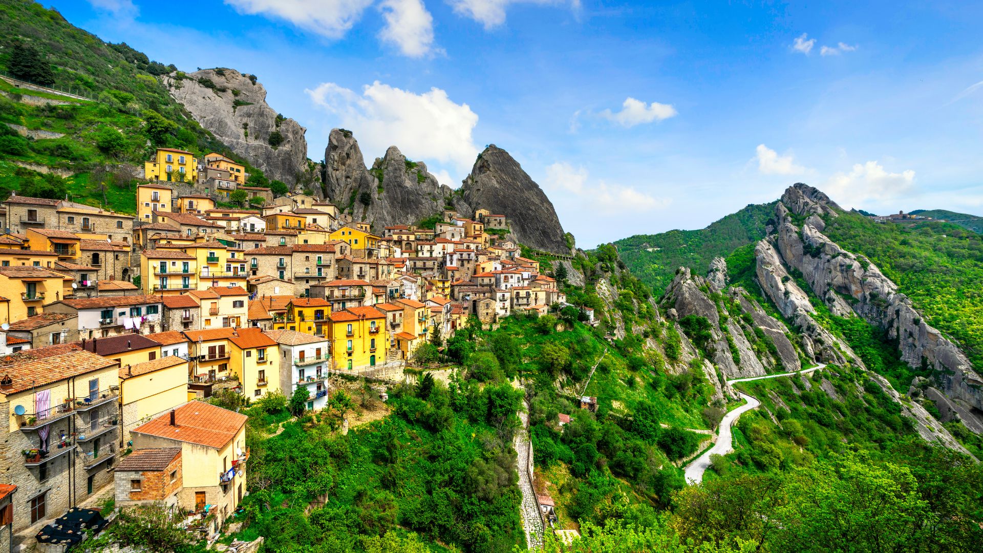 Image showing colorful houses in  Castelmezzano, Potenza, Italy and the  Lucanian Dolomites as backdrop. 