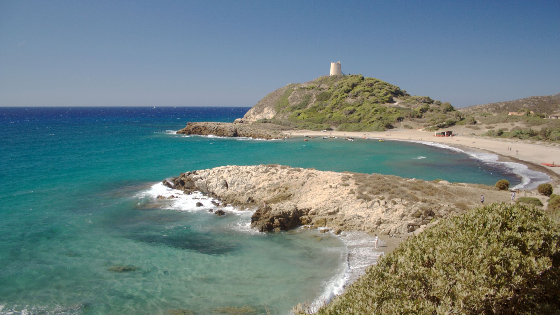 Chia beach in Sardinia, specifically featuring the Torre di Chia.