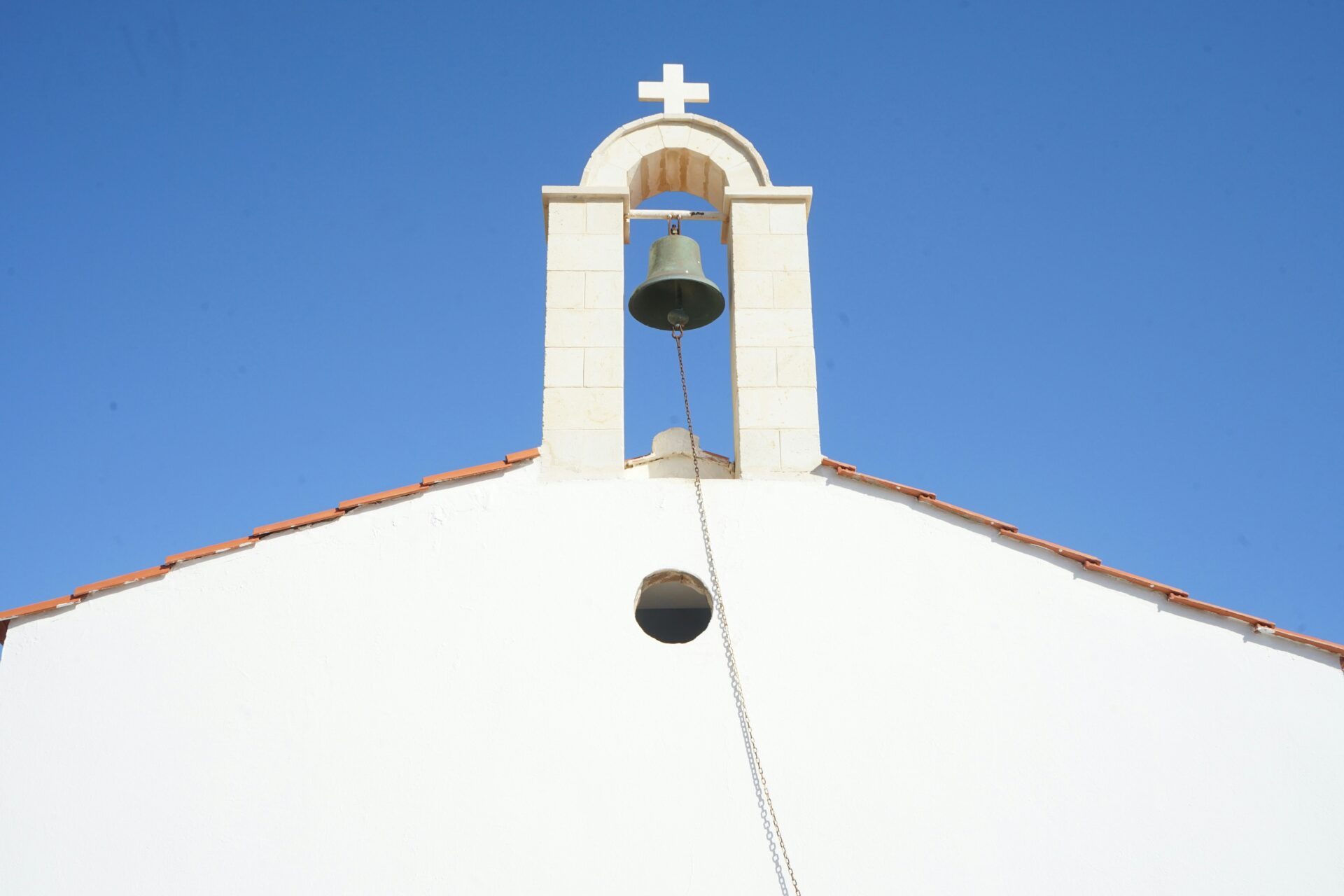 Close-up of the bell tower of Agios Ioannis Church in Loutro, Greece
