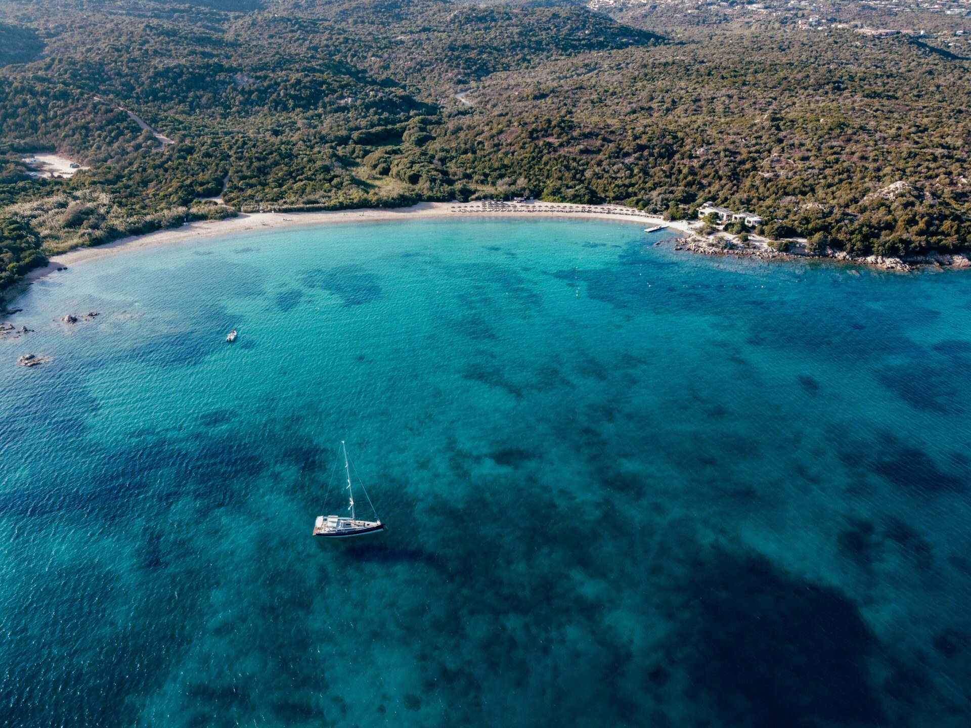 Aerial view of a breathtaking Sardinian beach with powdery white sand
