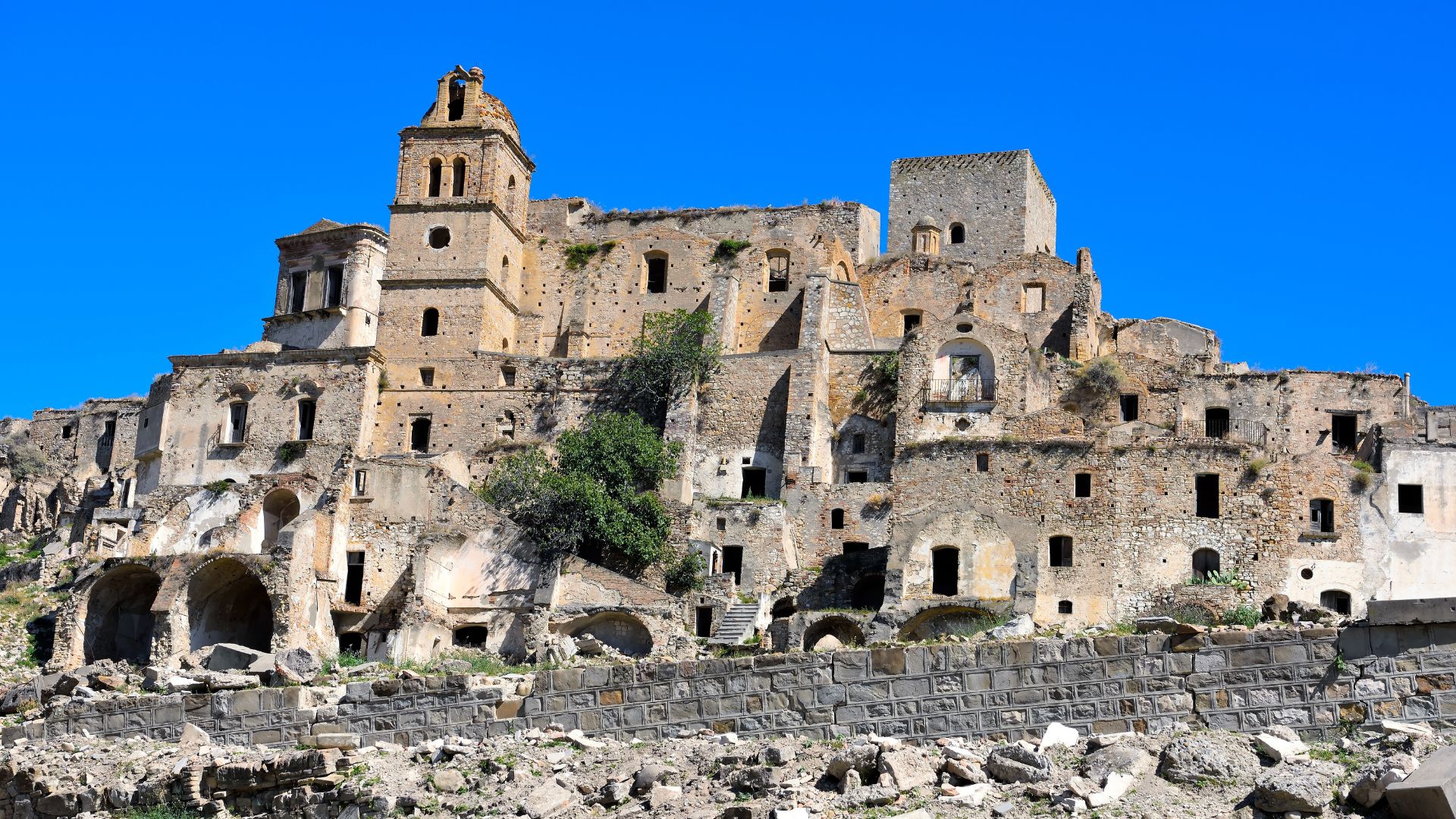 Image shows a ghost town in Craco, Basilicata, Italy.