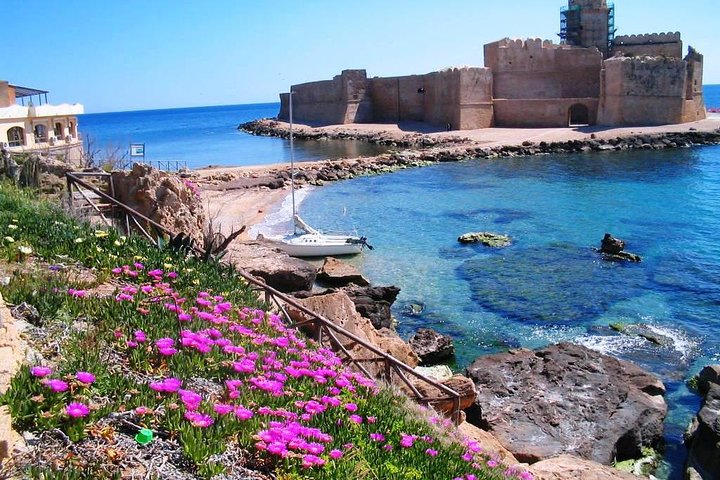 Historic Castello di Carlo V overlooking the scene from the coastline.