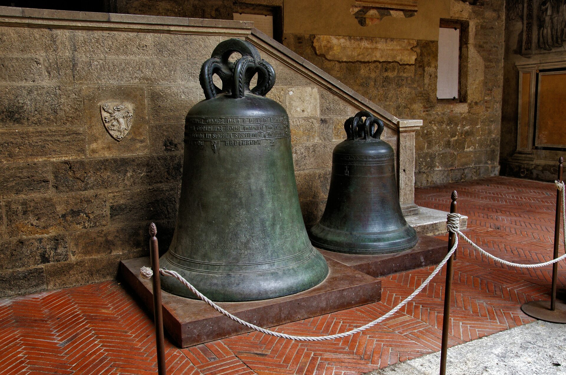 Display of large bells in a museum in Italy