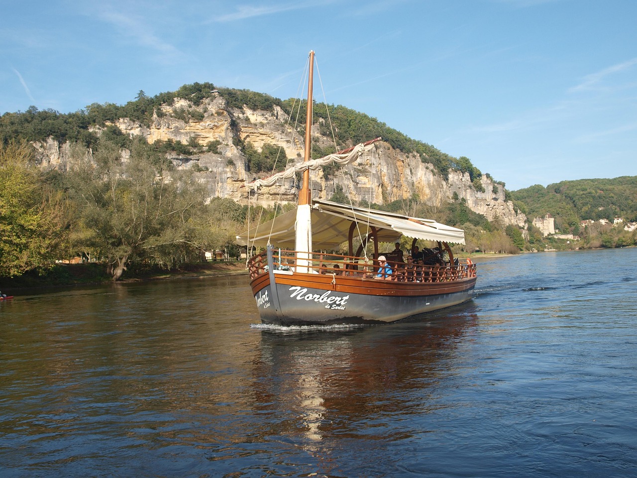 Dordogne River in France - tourist boat in river