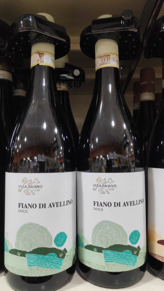 Bottles of Fiano di Avellino DOCG white wine by Villa Raiano displayed on a store shelf.