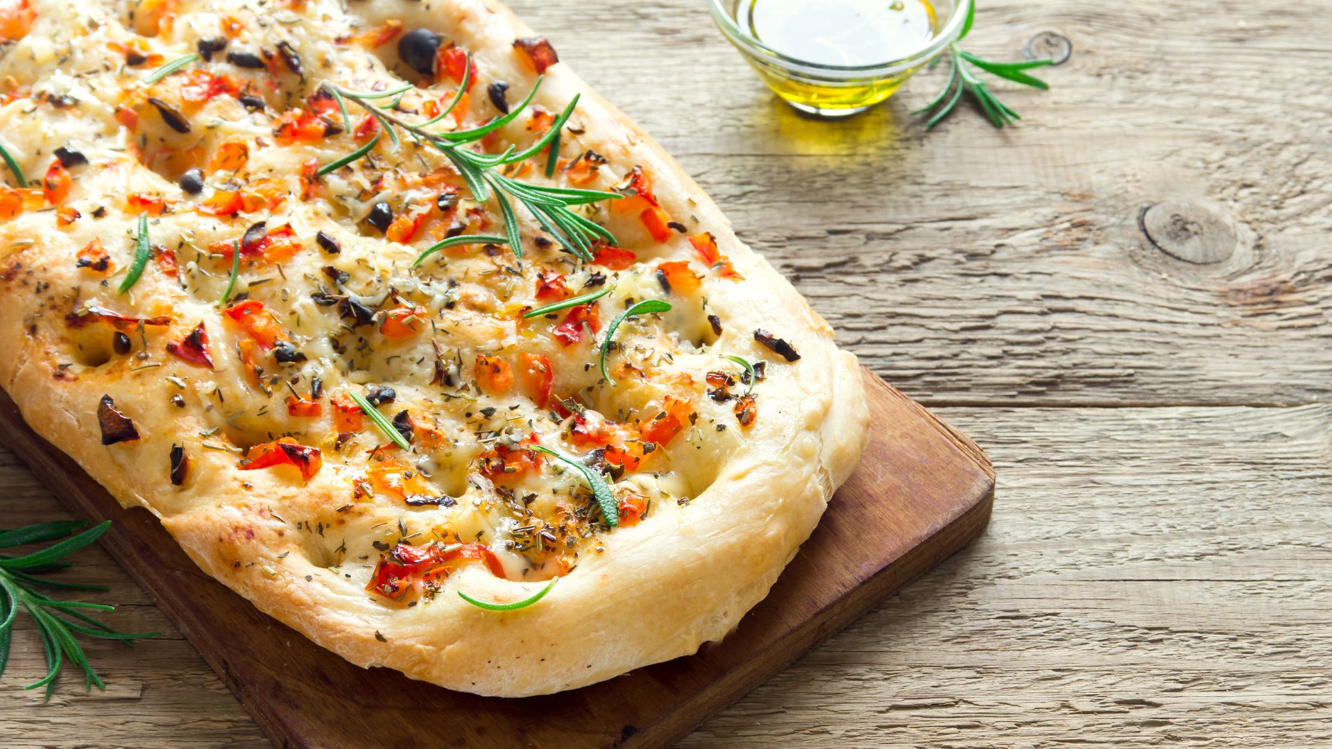 Focaccia on a wooden board.