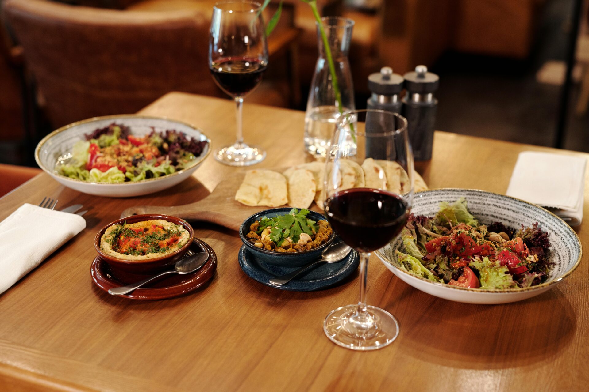Foods Beside Wine Glasses on a Wooden Table