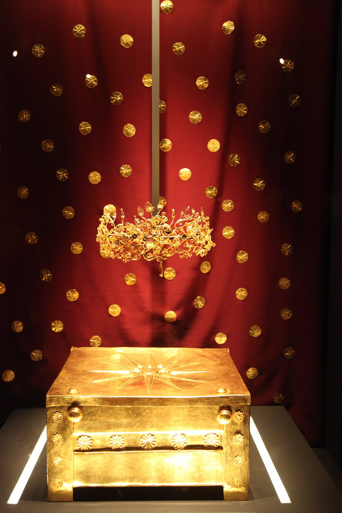 Golden larnax with sunburst emblem from ancient Macedon.