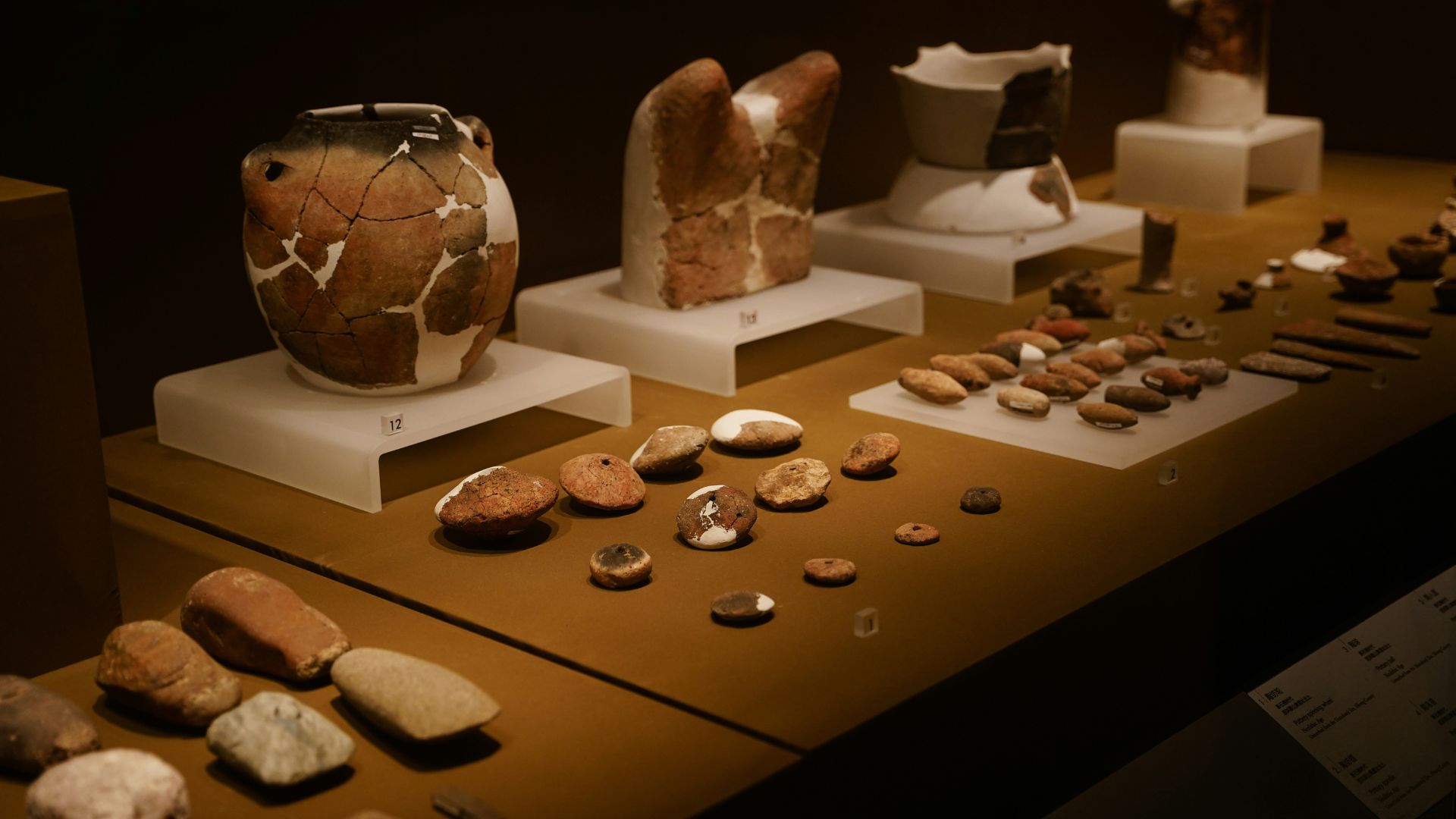 A display of ancient pottery and artifacts at the Heraklion Archaeological Museum.