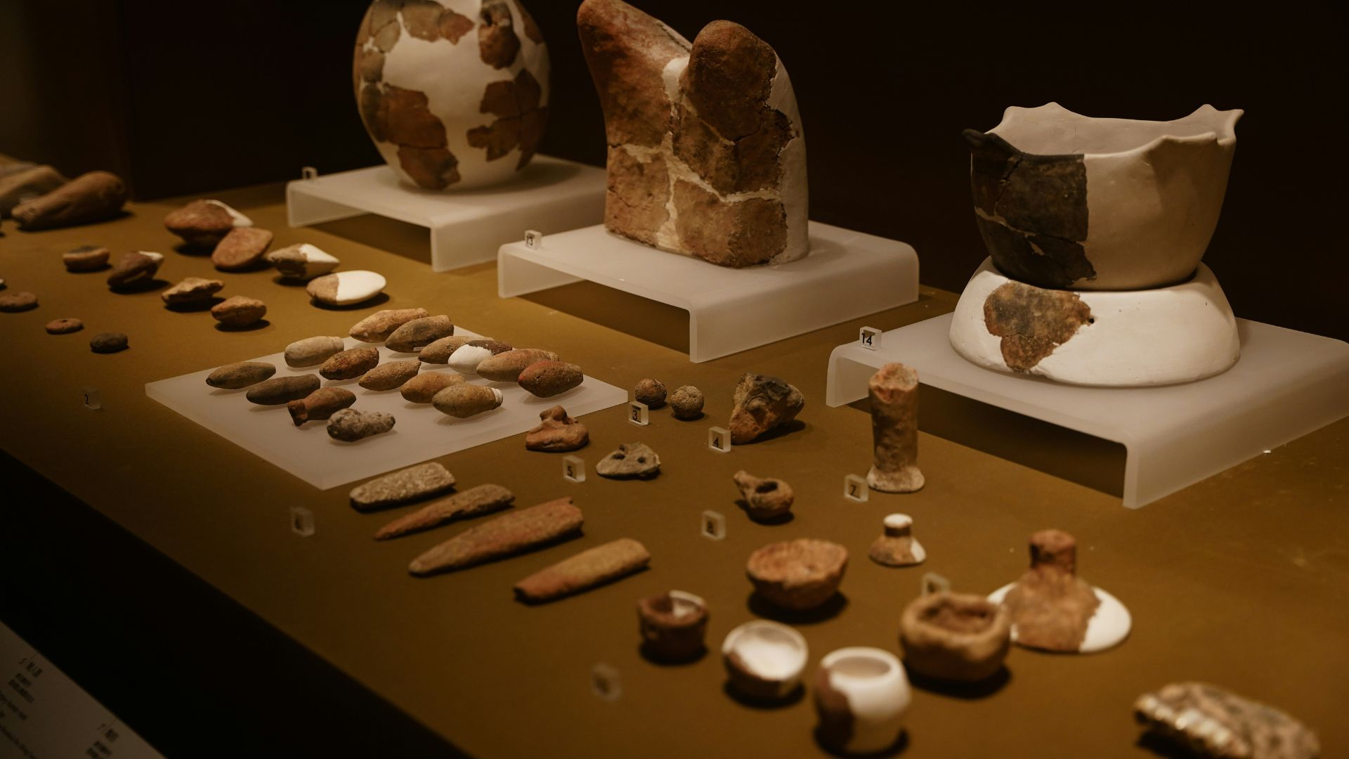 A display of ancient pottery and artifacts at the Heraklion Archaeological Museum.