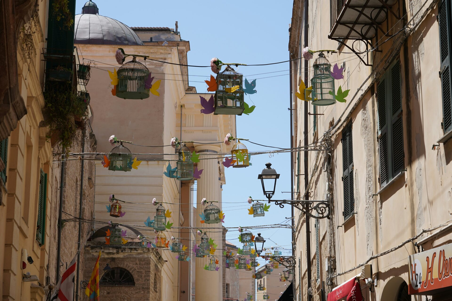 Traditional houses in Alghero with warm-toned facades
