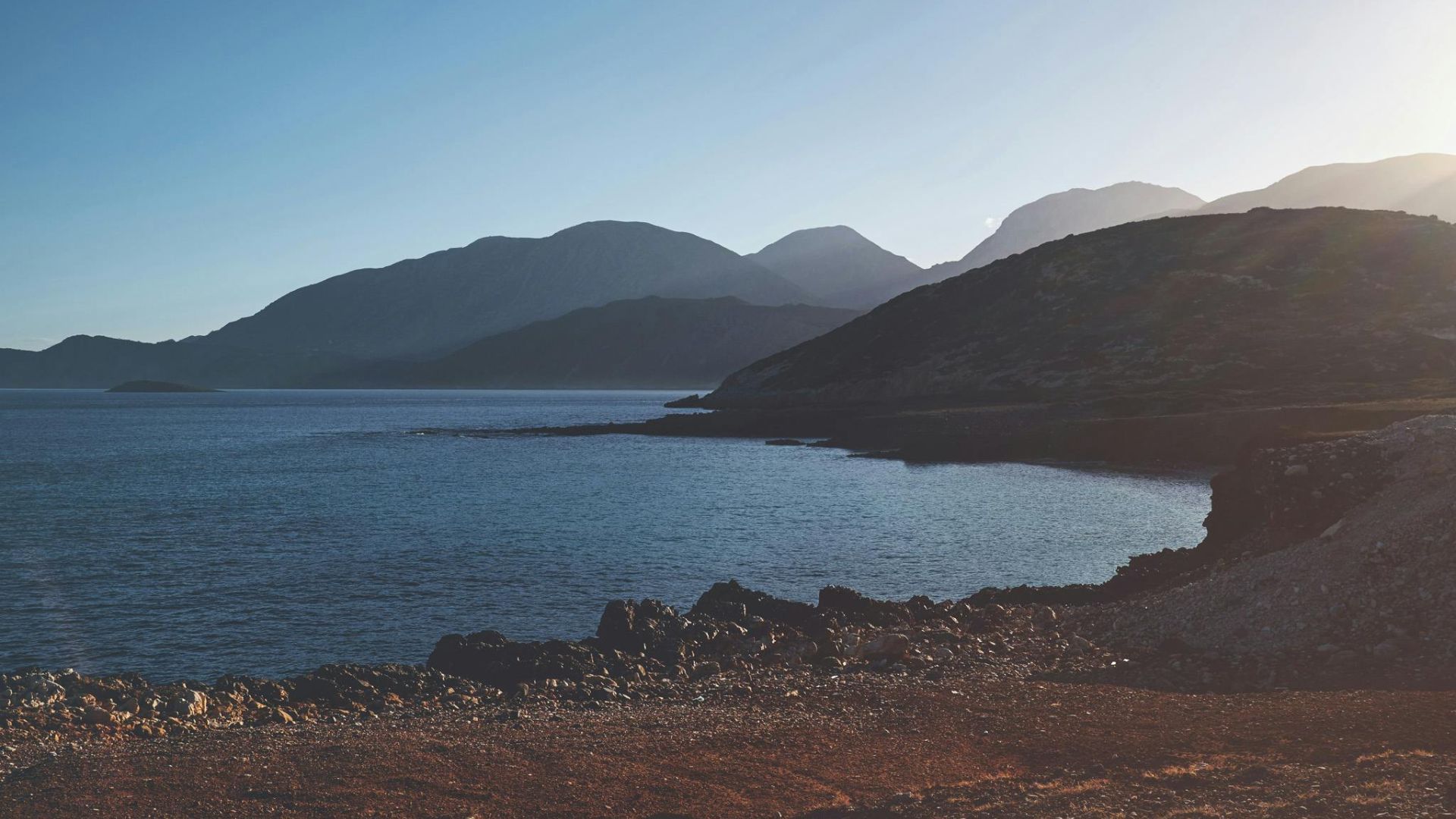 A scenic view of the coastline and mountains in Ierapetra, Crete, Greece.