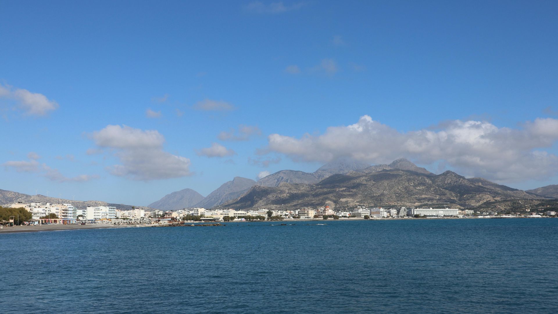 Coastal view of Ierapetra, Crete, with mountains in the background.