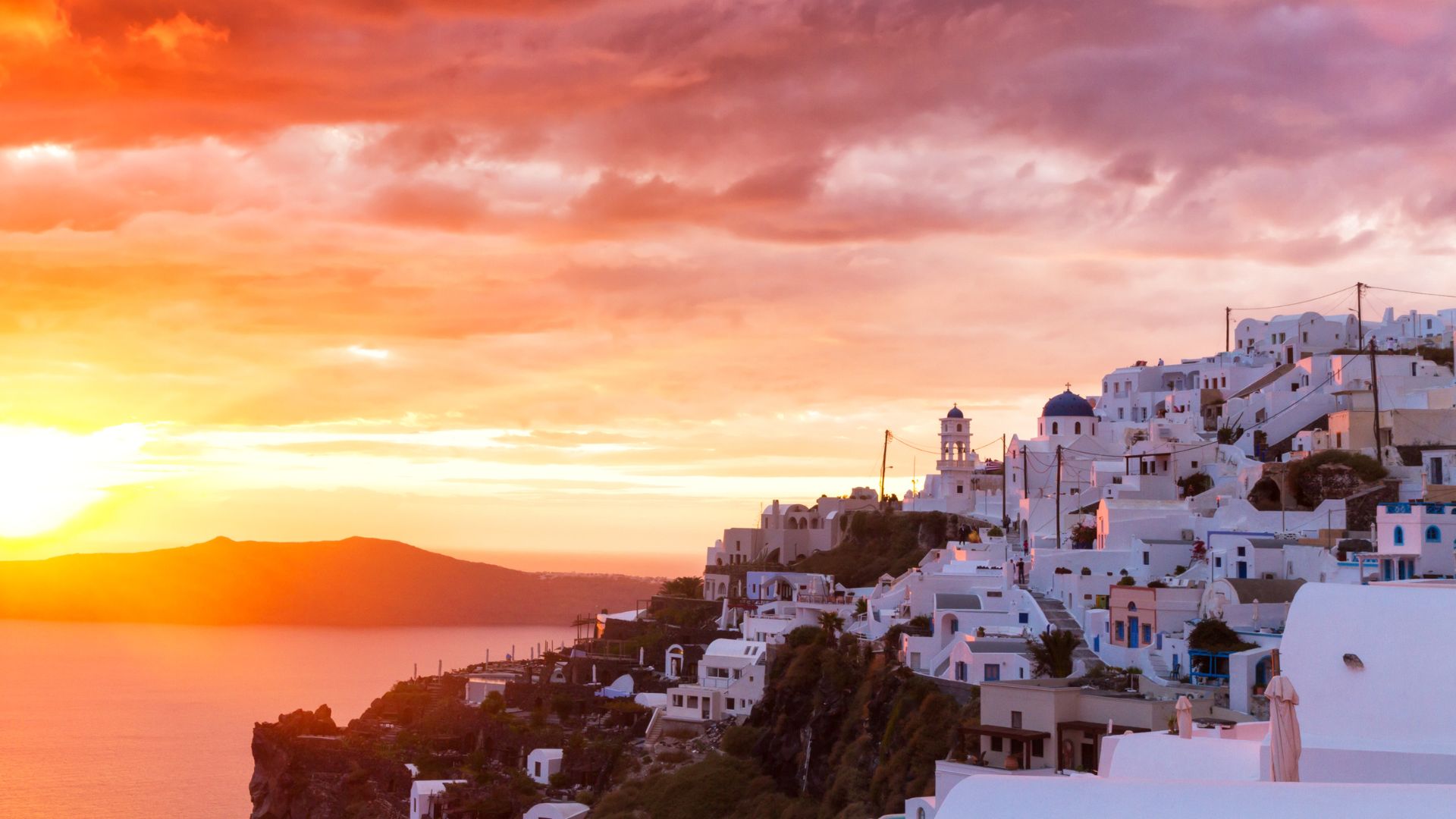 Whitewashed village of Imerovigli on the Santorini caldera. on sunset.
