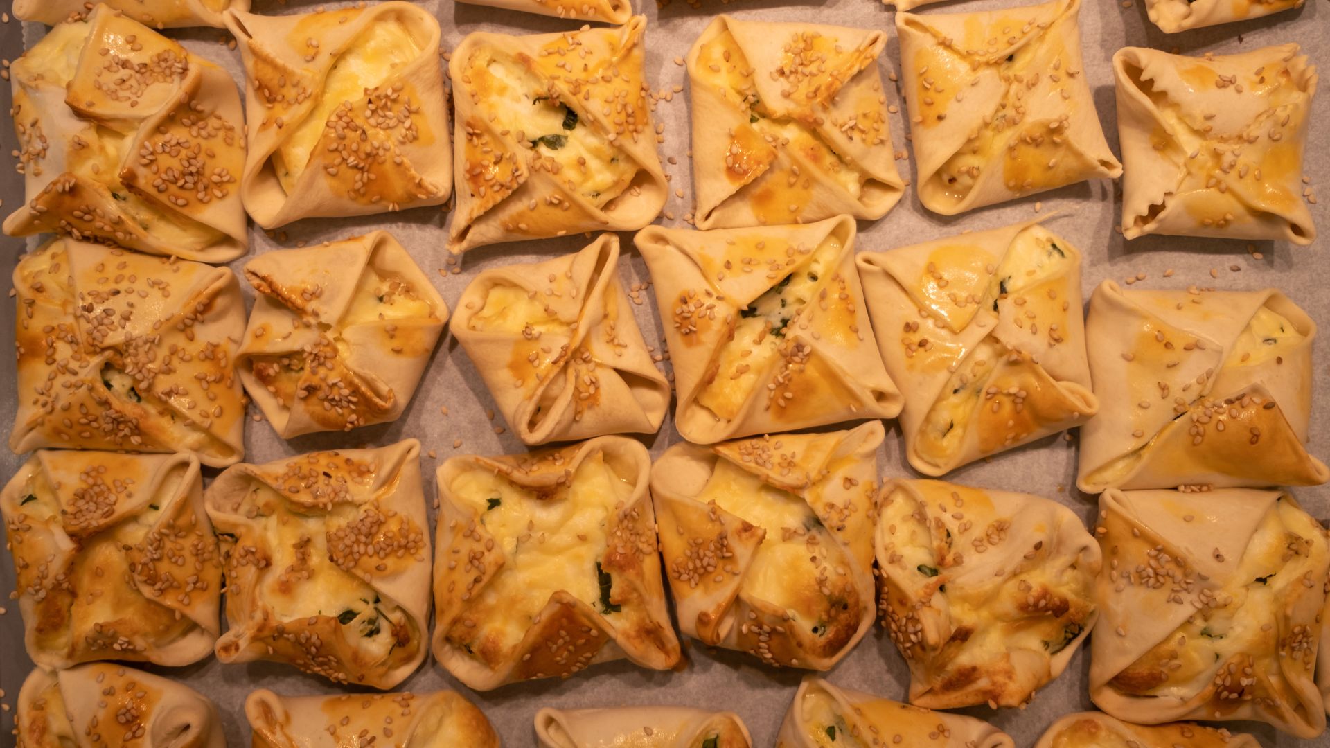 Sweet kalitsounia filled with cheese and honey.