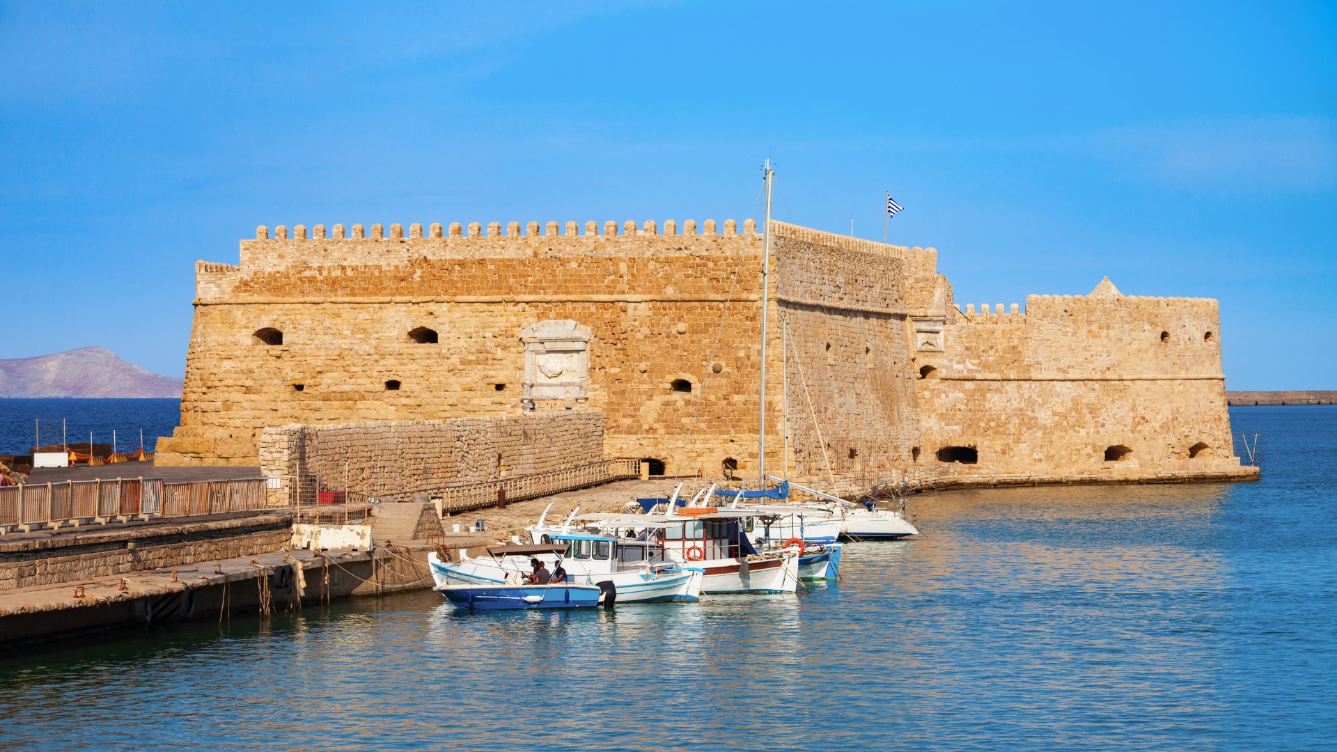 Koules Fortress in Heraklion, Crete, Greece and some docked boats.