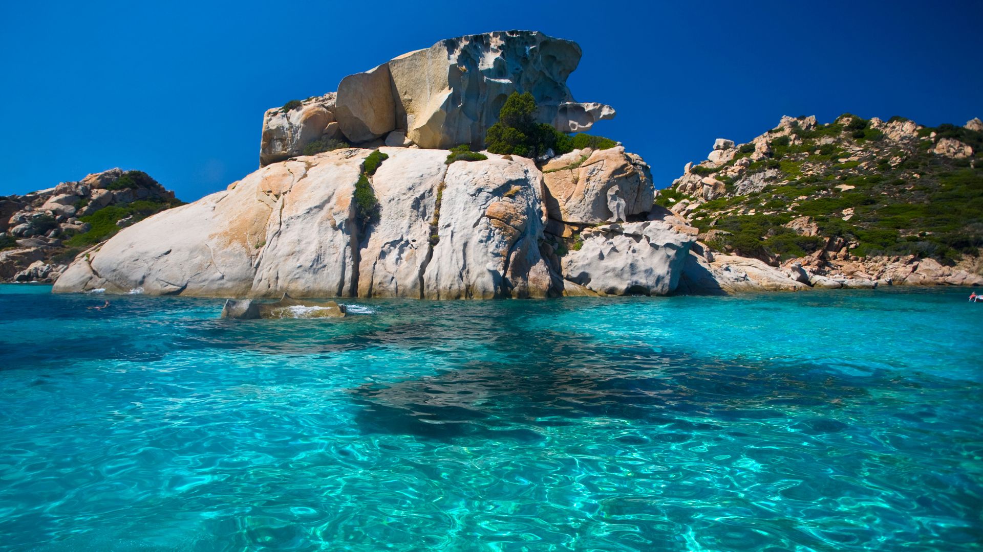 Clear turquoise water and rock formations of the Maddalena Archipelago, Sardinia.