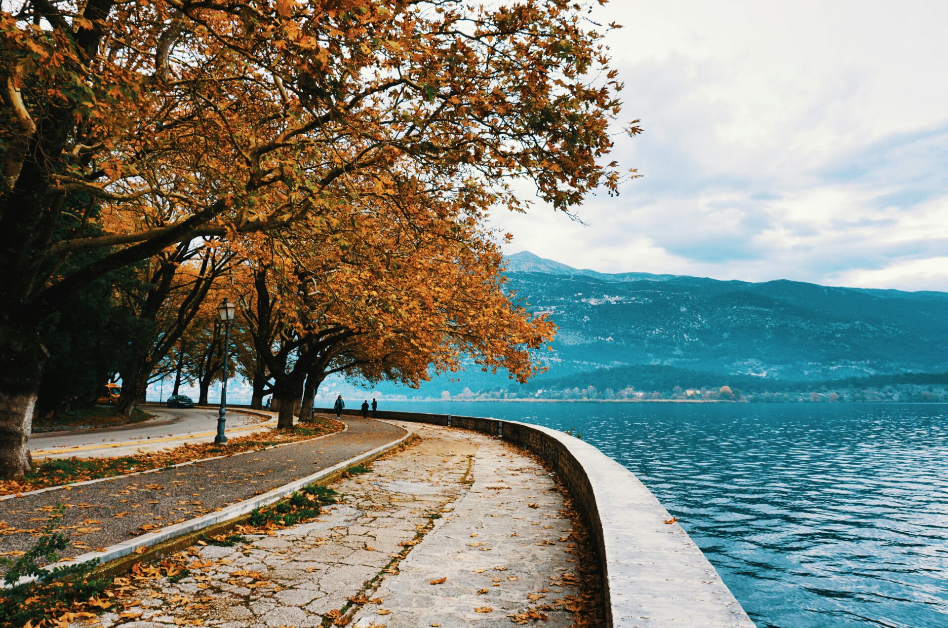Lake Pamvotida surrounded by vibrant autumn foliage