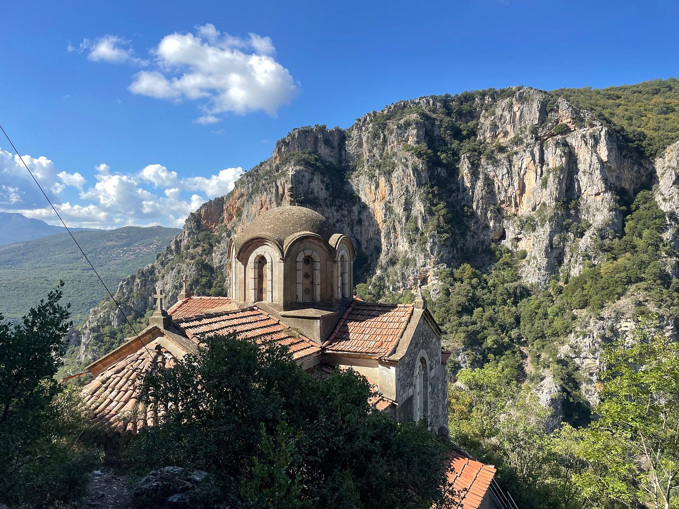 Dramatic Lousios Gorge in Greece with steep rocky cliffs and dense vegetation
