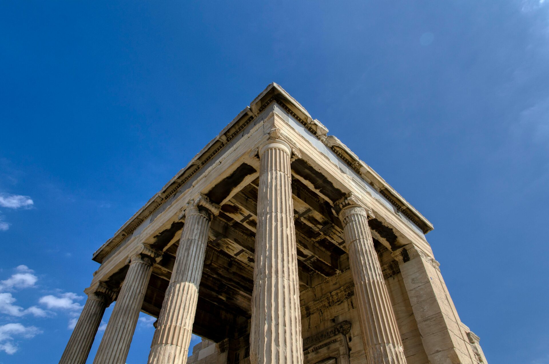 Low-Angle Shot of a Greek Building with Pillars