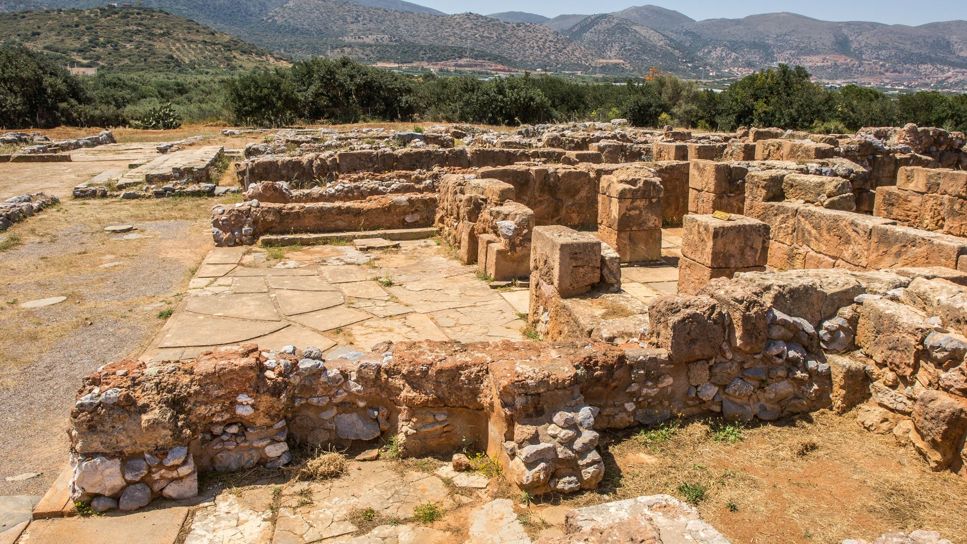 Ruins of the Palace of Malia, an ancient Minoan site with stone structures.