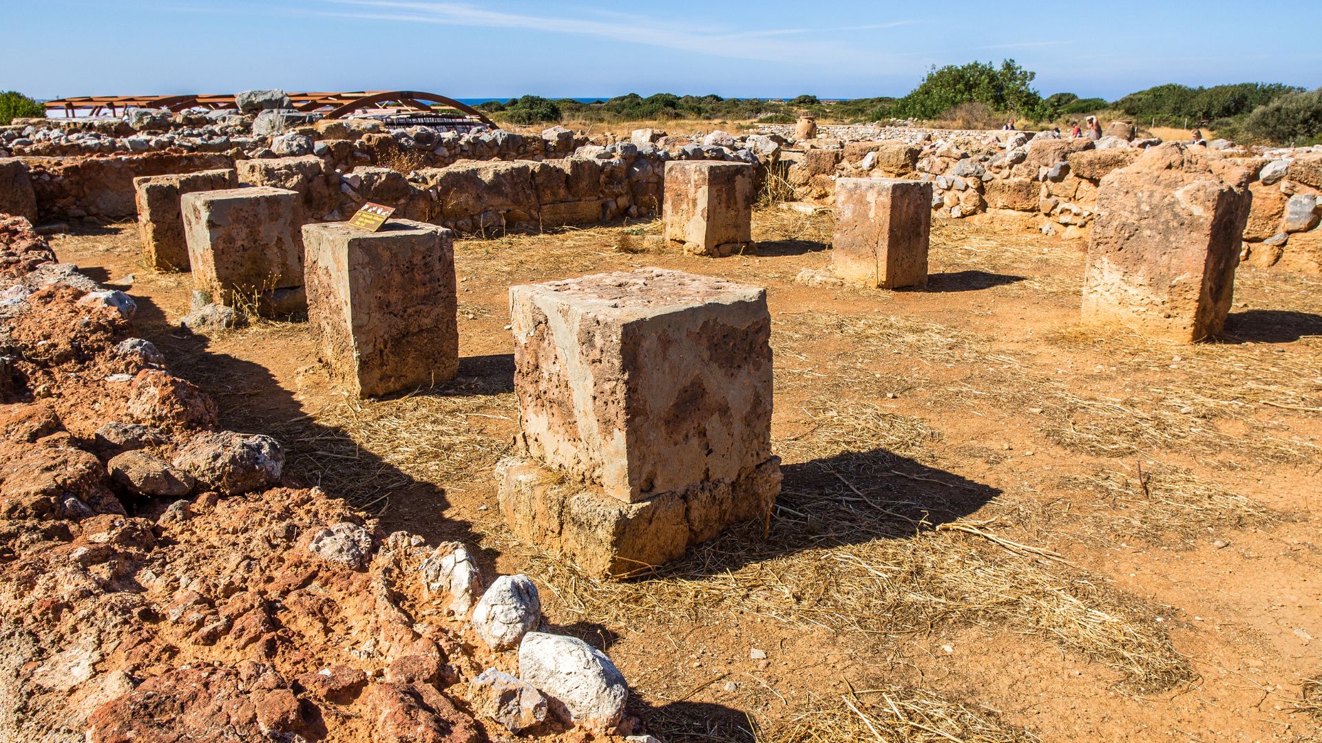 Ruins of the Palace of Malia, an ancient Minoan site with stone structures.