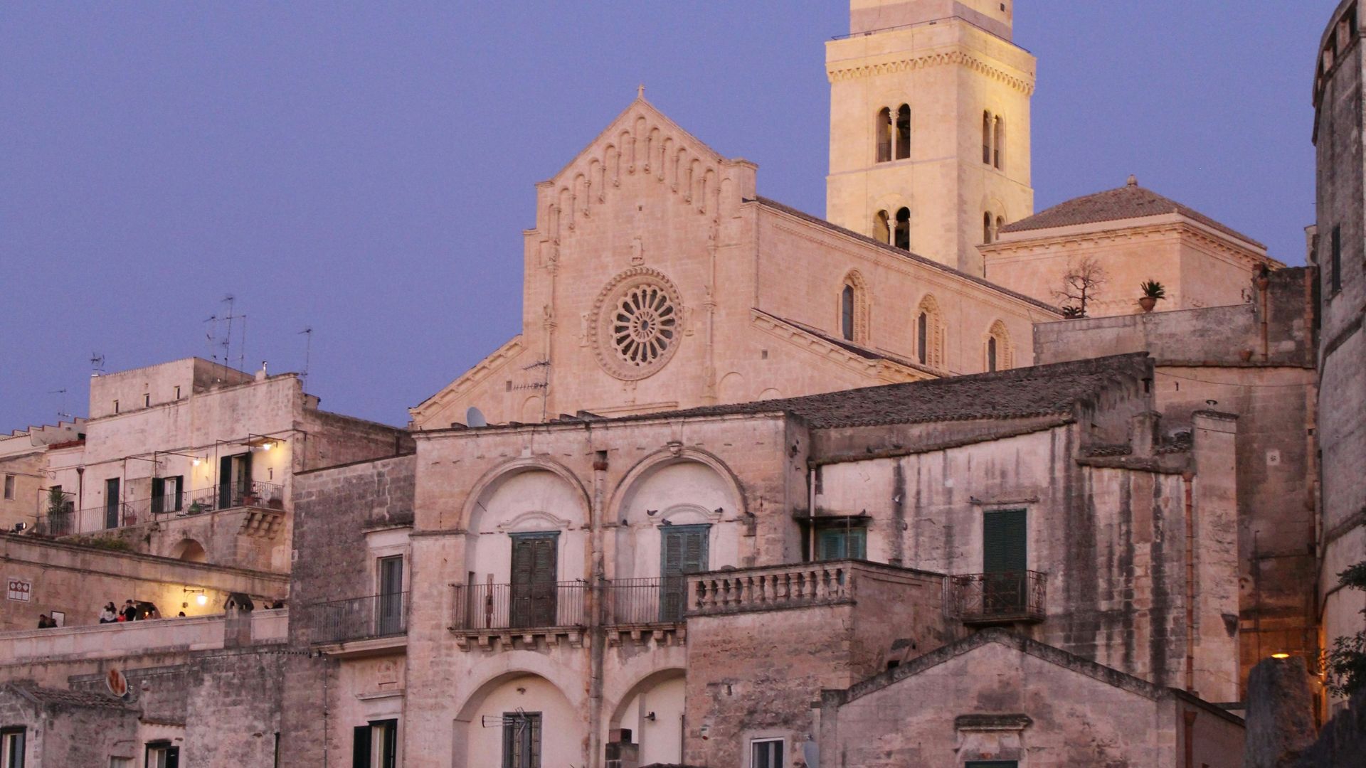 Image shows a church and houses in Sassi di Matera, Basilicata, Italy. 