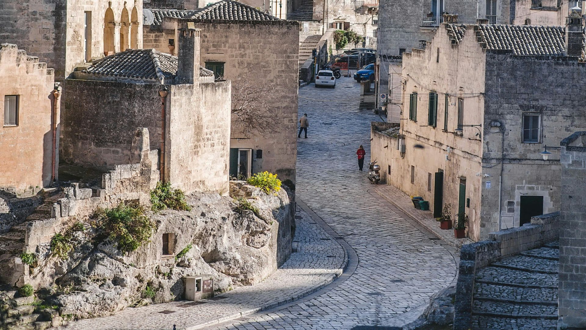 Image shows street and houses of Matera, Basilicata, Italy.