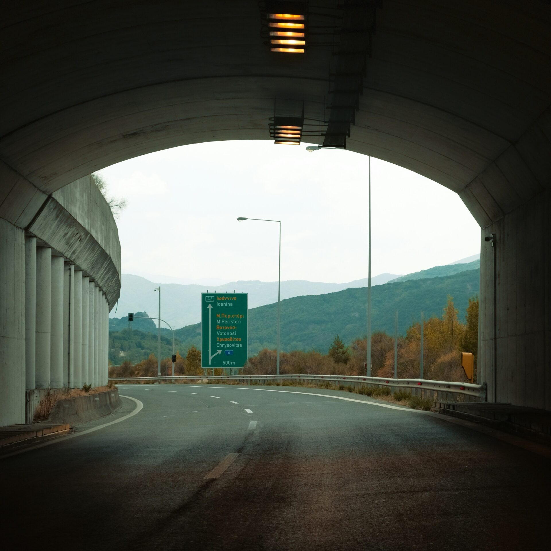 A scenic road in Metsovo, lined with vibrant autumn trees