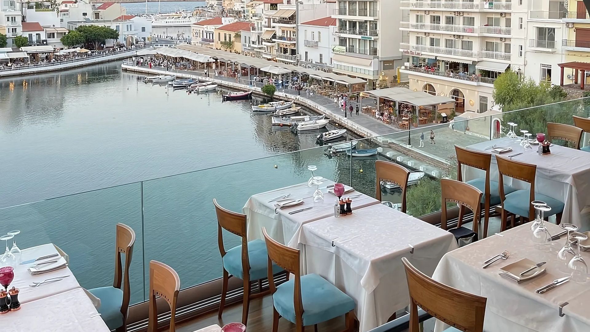 View from Migomis Piano Restaurant overlooking Lake Voulismeni and the town of Agios Nikolaos, Crete.