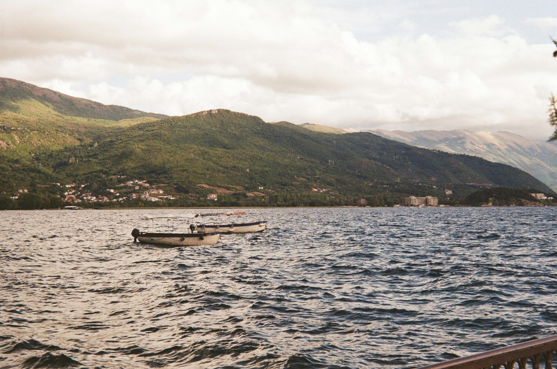 Peaceful lake nestled at the foot of forested mountains in the Macedonian region