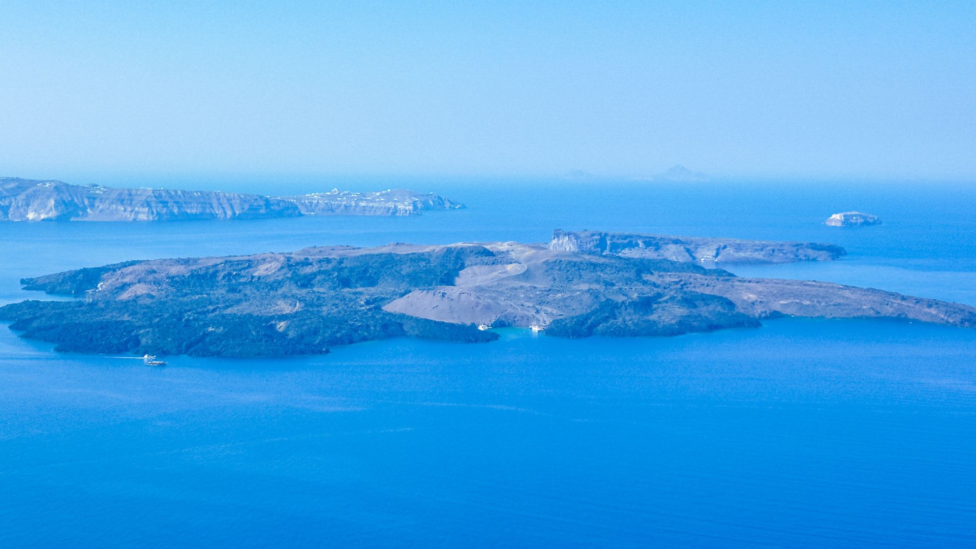 Aerial view of Nea Kameni, a volcanic island in the Santorini caldera.