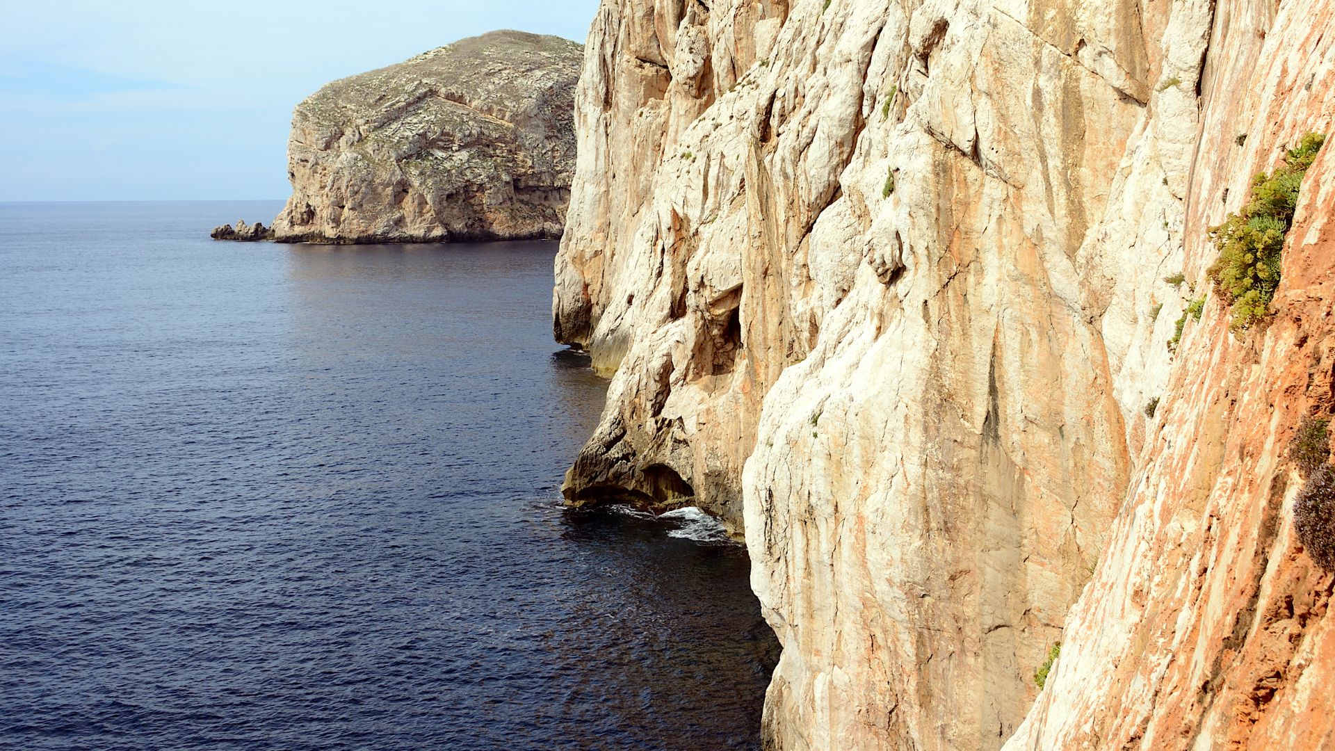 Cliffs of Capo Caccia, with the entrance to Neptune's Grotto visible at the base.