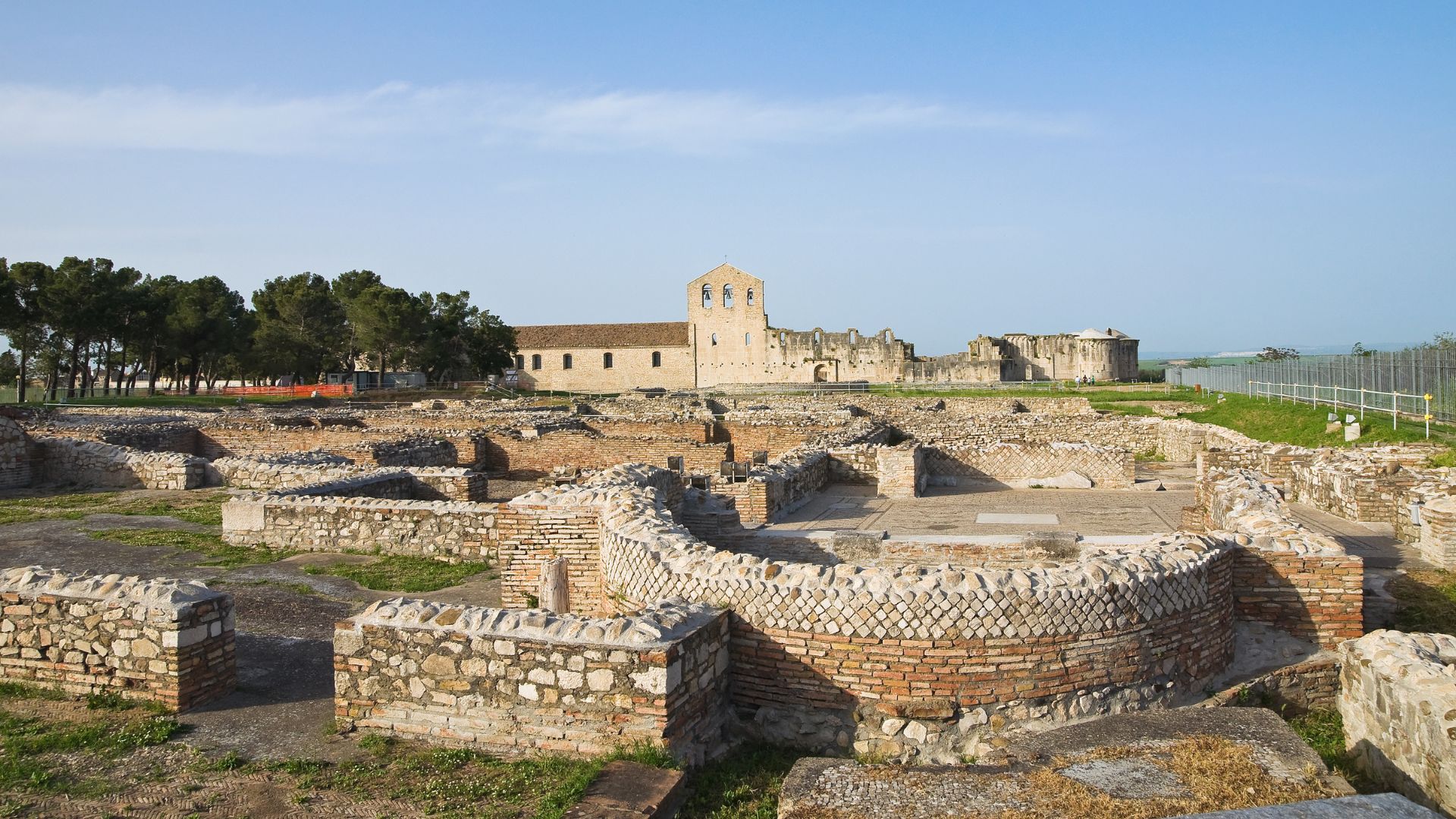 The image shows the Parco archeologico di Venosa, also known as the Archaeological Park of Venosa, located in Venosa, Italy. This site includes the ruins of the Roman baths, among other historical structures.