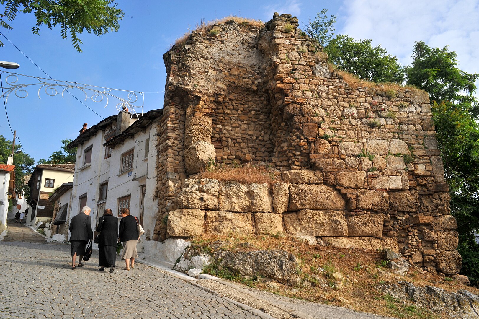 Stone walls of Didymoteicho Castle on a sunny day.