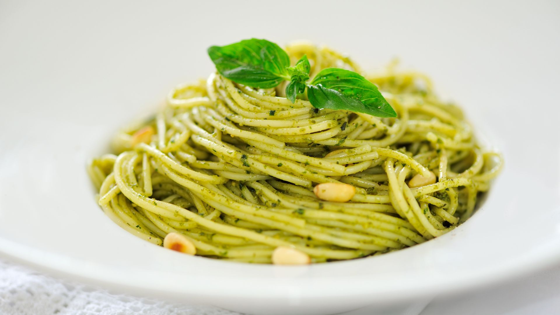 Pasta with an Italian paste made with basil leaves, crushed garlic, pine nuts, olive oil, salt, and grated hard cheese.