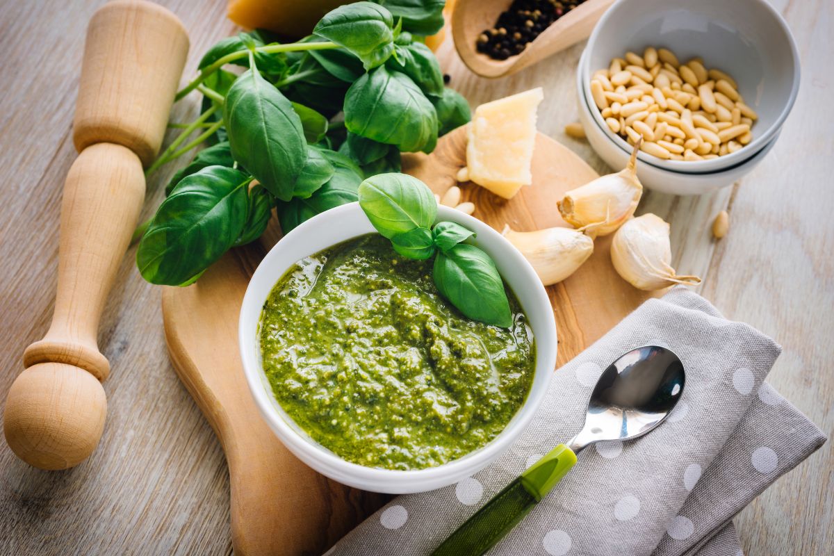Pesto and other ingredients on the table. 