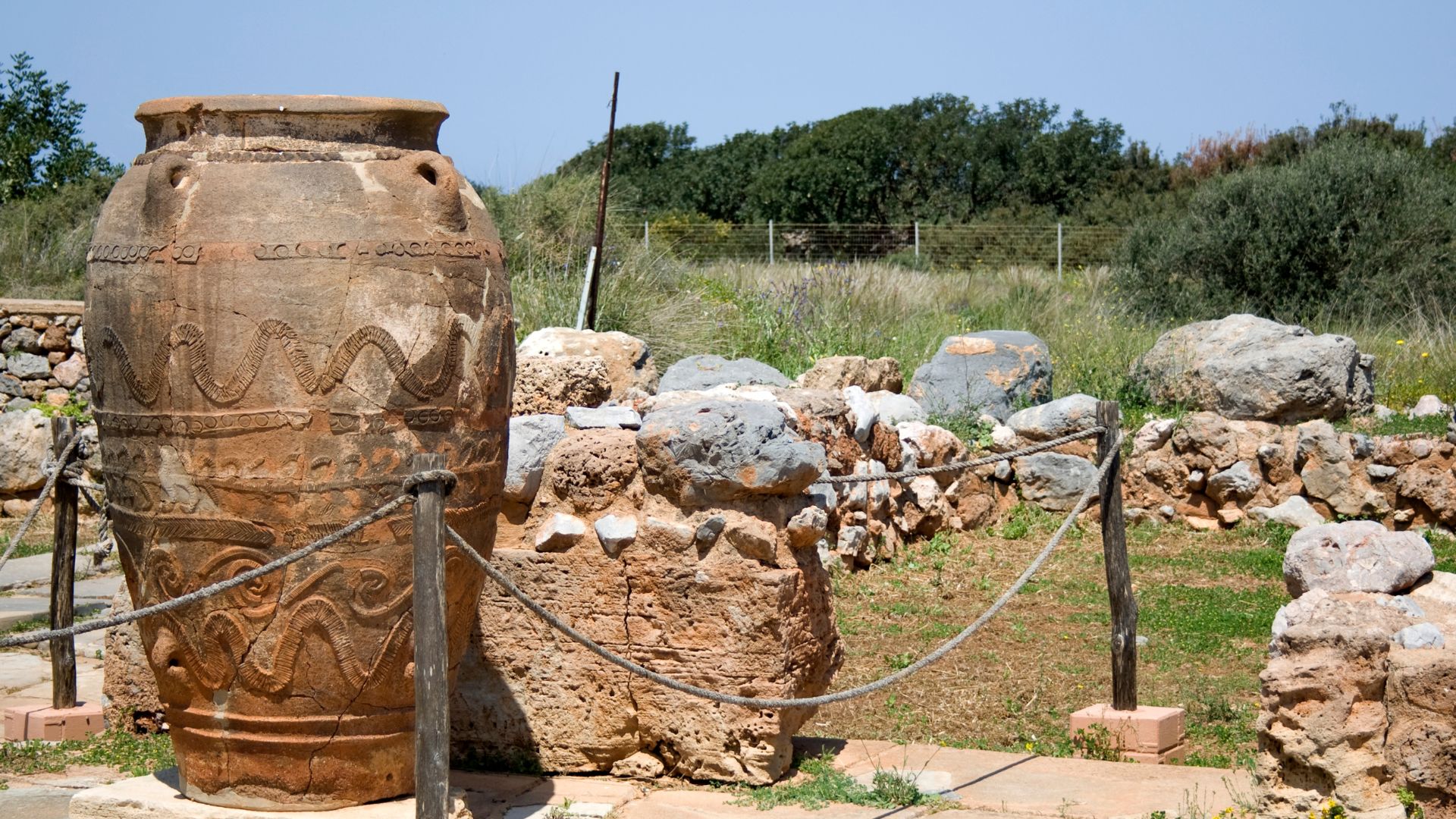 A large, ancient storage jar at the Malia Minoan Palace archaeological site in Crete.