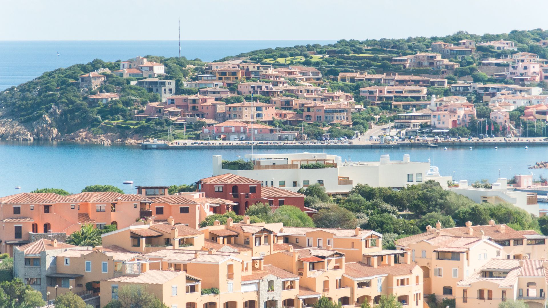 Aerial view of Costa Smeralda (Emerald Coast), Sardinia, Italy houses, greenery, and blue waters