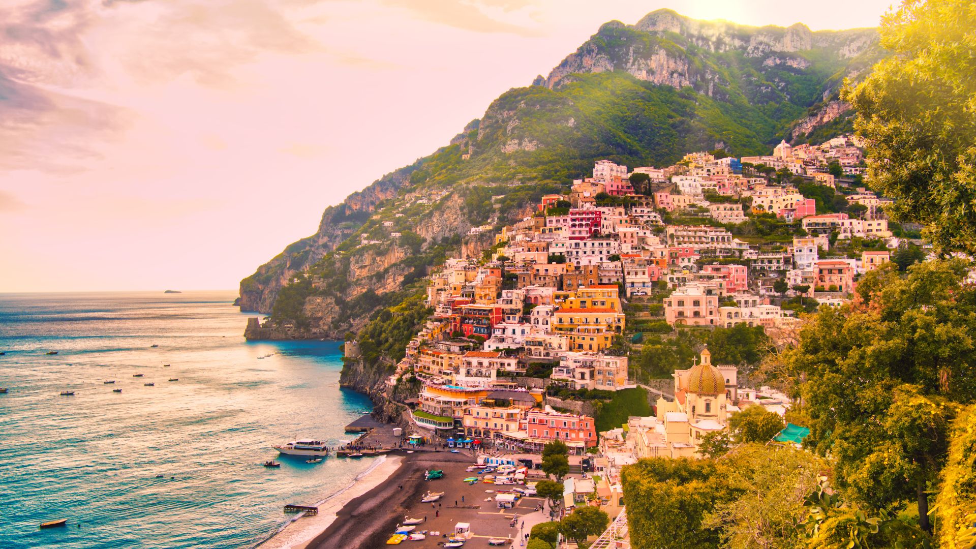Pastel houses spilling down to the sea, Positano in Amalfi Coast, Italy.